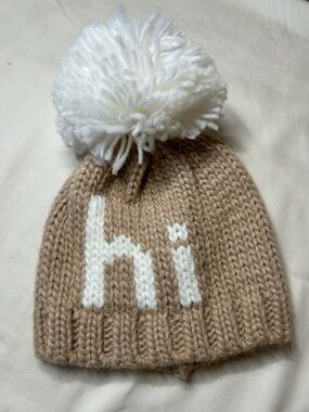 Baby Tan Knit Beanie with White Pom and "hi" Accent